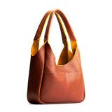 Sienna Medium | U-shaped, flat-bottomed leather shoulder bag with two outside pockets