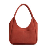 Cinnabar Medium | U-shaped, flat-bottomed leather shoulder bag with two outside pockets