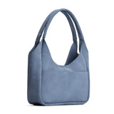 Denim Medium | U-shaped, flat-bottomed leather shoulder bag with two outside pockets