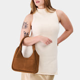 Jackson Medium | U-shaped, flat-bottomed leather shoulder bag with two outside pockets