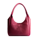 Orchid Medium | U-shaped, flat-bottomed leather shoulder bag with two outside pockets