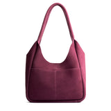 Superbloom Large | U-shaped, flat-bottomed leather shoulder bag with two outside pockets