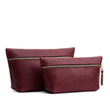 Cabernet | Comparison image of two leather makeup bags with zippers