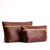 Cognac | Two large leather makeup bags with zipper
