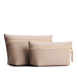 Stone | Two large leather makeup bags with zipper