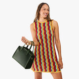 Evergreen Medium | Model carrying leather tote bag with handles, adjustable crossbody strap, and two back pockets