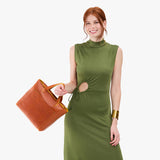 Sienna Zipper | Model holding midsize crossbody tote with handles and a pocket