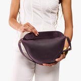 Larkspur Medium | Model wearing petite half circle shaped sling bag
