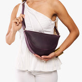 Larkspur Medium | Model wearing petite half circle shaped sling bag