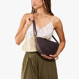Moose Medium | Model wearing petite half circle shaped sling bag