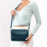 Lagoon Medium | Model wearing Small Leather Crossbody Bag with Magnetic Messenger Bag Closure