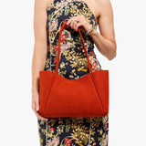 Paprika Medium | Model holding midsize rectangular tote bag
