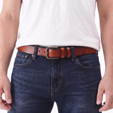Amber | A model wearing a mens leather belt with two belt loops and antiqued brass buckle