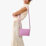 Calla Lily Medium | Model Wearing Small Leather Crossbody Bag with Magnetic Messenger Bag Closure