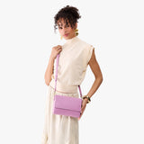 Calla Lily Medium | Model Wearing Small Leather Crossbody Bag with Magnetic Messenger Bag Closure