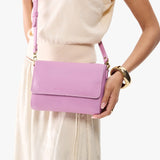 Calla Lily Medium | Model Wearing Small Leather Crossbody Bag with Magnetic Messenger Bag Closure