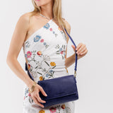 Cobalt Medium | Model Wearing Leather Crossbody Bag with Magnetic Messenger Bag Closure