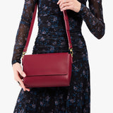 Berry Good Medium | Model Wearing Small Leather Crossbody Bag with Magnetic Messenger Bag Closure