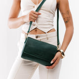 Forest Green Medium | Model Wearing Small Leather Crossbody Bag with Magnetic Messenger Bag Closure