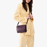 Larkspur Medium | Model wearing leather Crossbody Bag with Magnetic Messenger Bag 