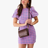 Chocolate Brown Mini | Model Wearing Small Leather Crossbody Bag with Magnetic Messenger Bag Closure