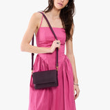 Larkspur Mini | Model wearing leather Crossbody Bag with Magnetic Messenger Bag 