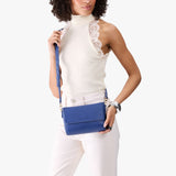Molino Blue Mini | Model Wearing Small Leather Crossbody Bag with Magnetic Messenger Bag Closure
