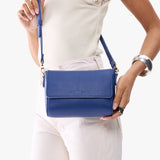 Molino Blue Mini | Model Holding Small Leather Crossbody Bag with Magnetic Messenger Bag Closure