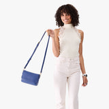 Molino Blue Mini | Model Holding Small Leather Crossbody Bag with Magnetic Messenger Bag Closure