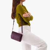 Model wearing leather Crossbody Bag with Magnetic Messenger Bag Closure