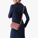 Sunkissed Mini | Model Wearing Small Leather Crossbody Bag with Magnetic Messenger Bag Closure