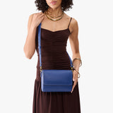 Molino Blue Medium | Model Wearing Leather Crossbody Bag with Magnetic Messenger Bag Closure