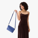 Molino Blue Medium | Model Holding Leather Crossbody Bag with Magnetic Messenger Bag Closure