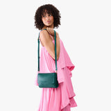 Sea Glass Medium | Model Wearing Leather Crossbody Bag with Magnetic Messenger Bag Closure