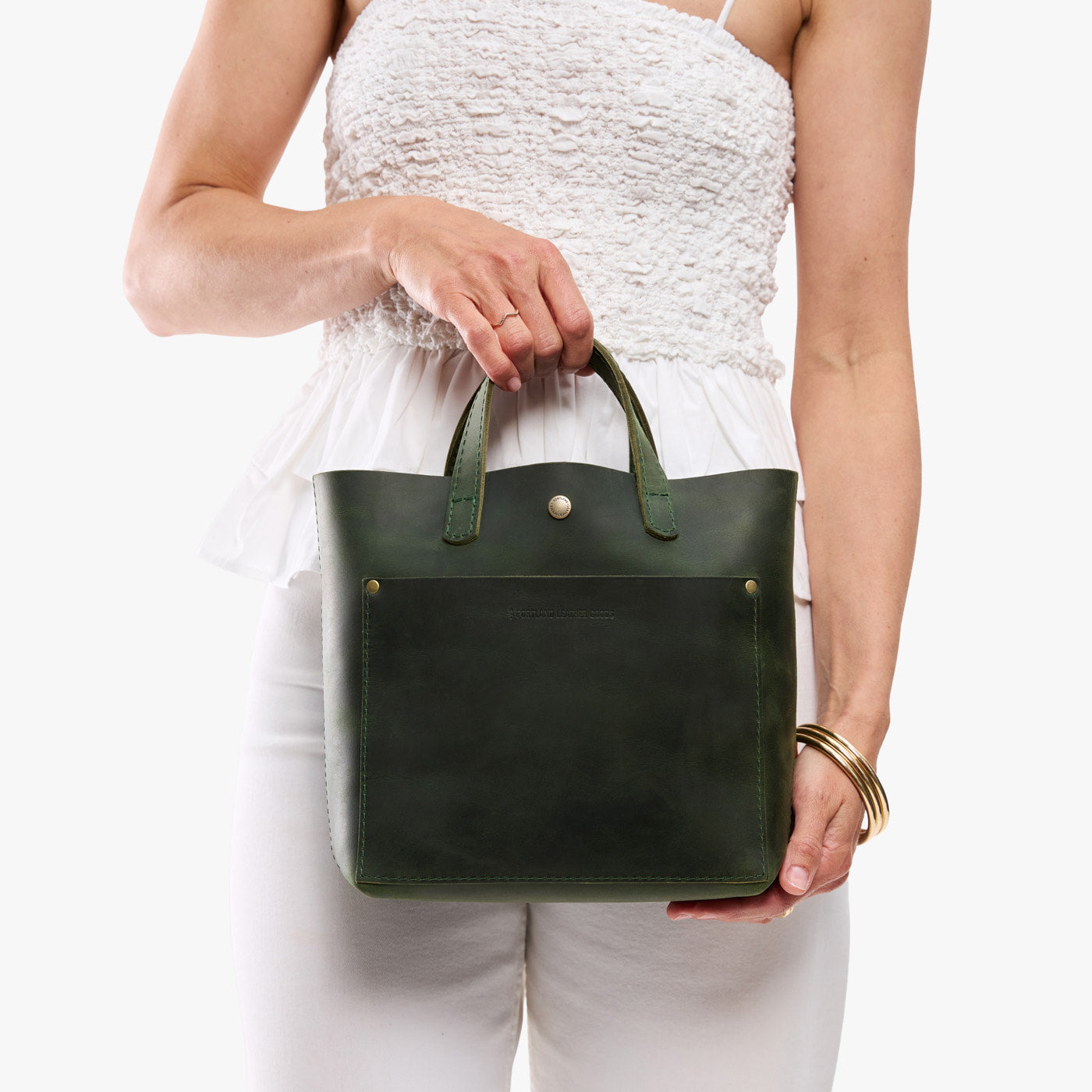 Evergreen*Classic | Model carrying crossbody tote bag with snap closure and front pocket