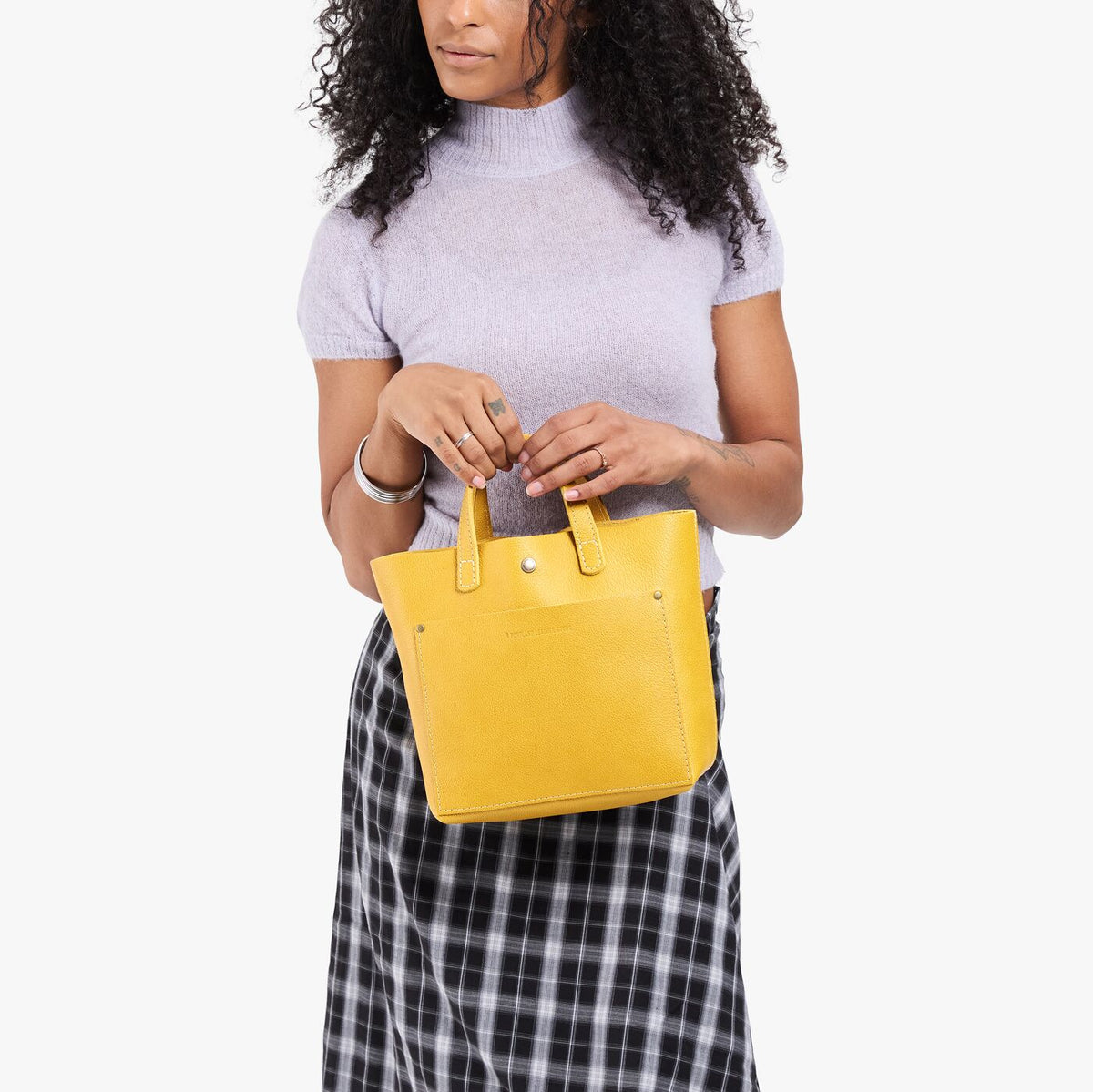 Pomello*Classic | Model wearing crossbody tote bag with snap closure and front pocket