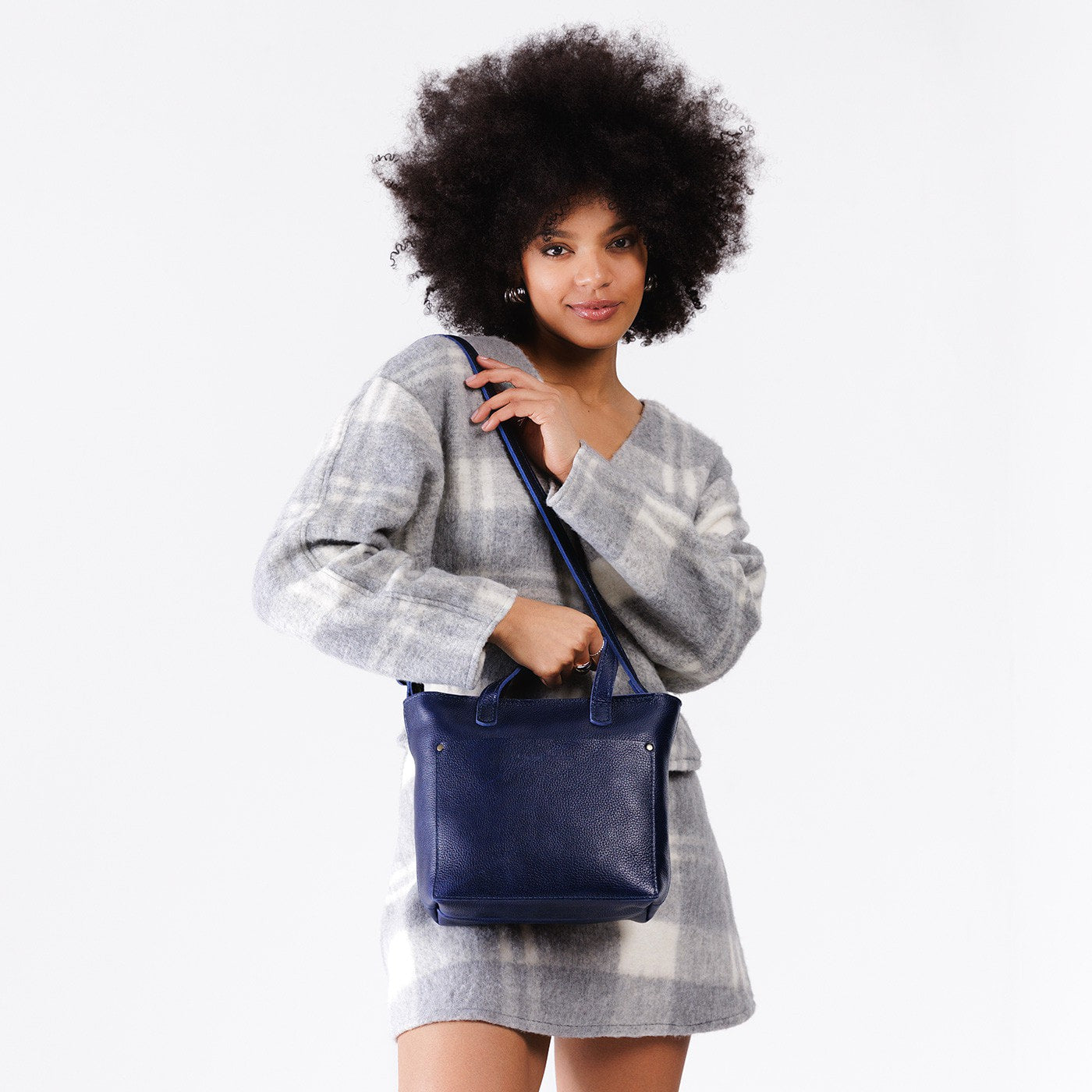 Cobalt*Zipper | Model wearing crossbody tote bag with snap closure and front pocket