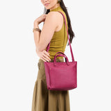 Cosmo Zipper | Model carrying crossbody tote bag with zipper closure and front pocket