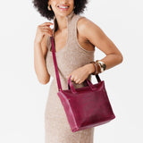 Orchid Zipper | Model wearing crossbody tote bag with zipper closure and front pocket