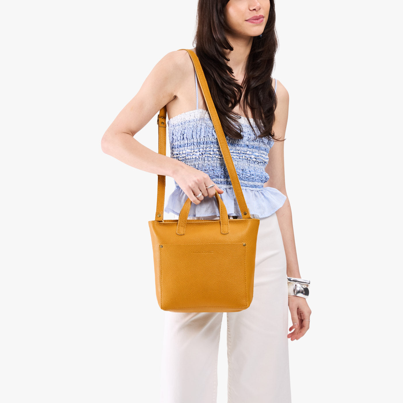 Sunshine*Zipper | Model carrying crossbody tote bag with snap closure and front pocket