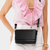 Black Mini | Model Wearing Small Leather Crossbody Bag with Magnetic Messenger Bag Closure