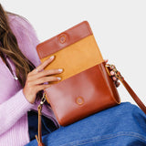 Madrone Mini | Model Wearing Small Leather Crossbody Bag with Magnetic Messenger Bag Closure