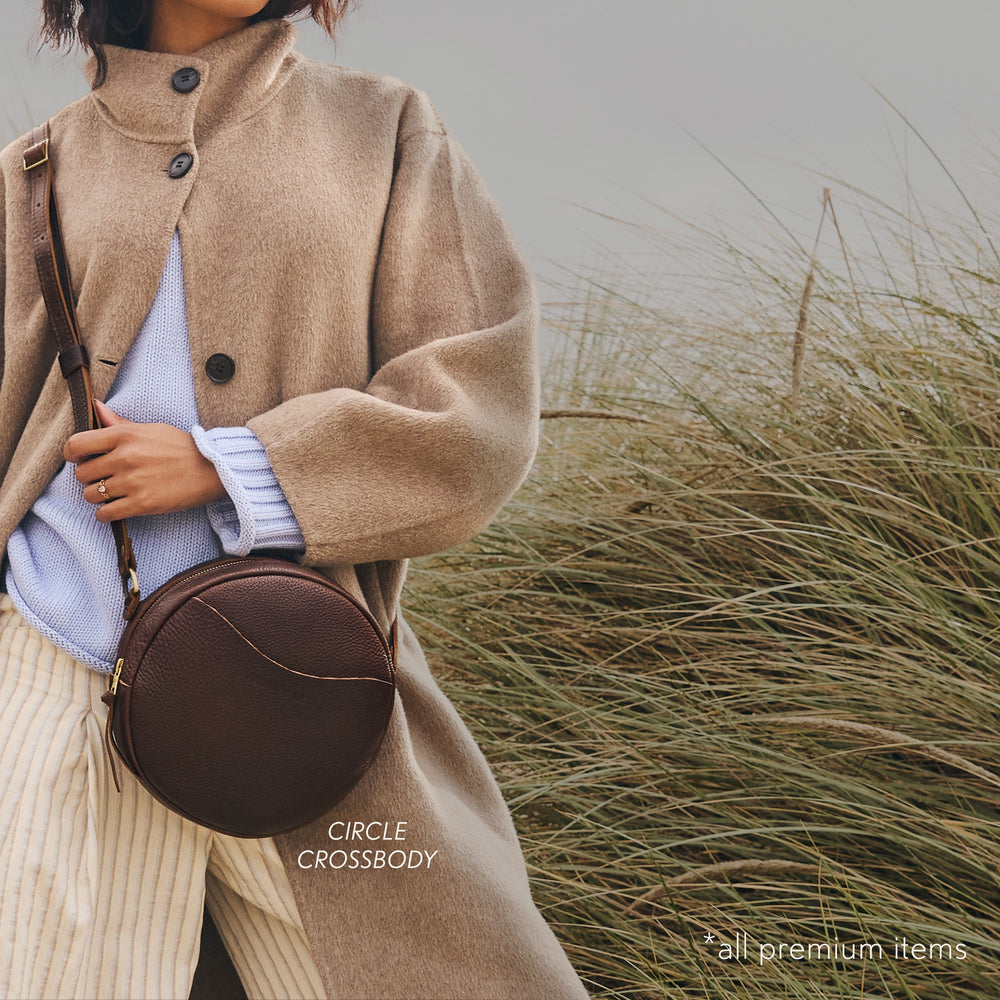 A model wearing a Coldbrew Circle Crossbody bag.