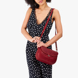 Chili Red Large | Model wearing a leather Crossbody with a flap and magnetic closure