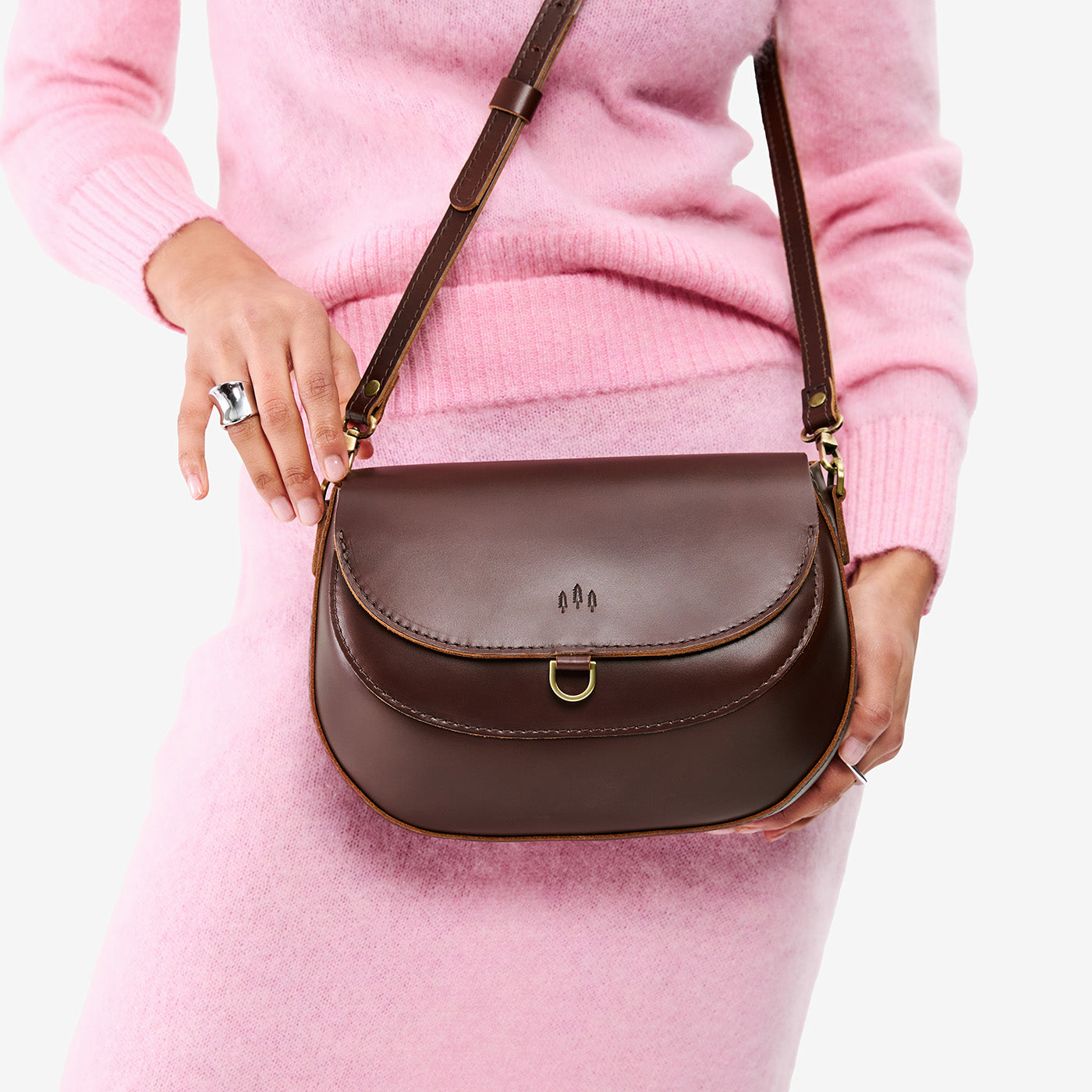 Chocolate Brown*Large | Model wearing a leather Crossbody with a flap and magnetic closure