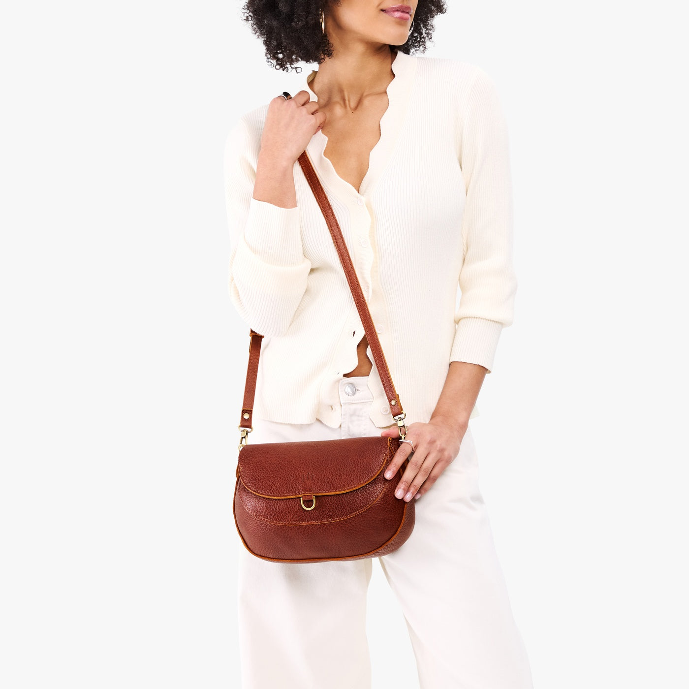 Nutmeg*Large | Model wearing a leather Crossbody with a flap and magnetic closure