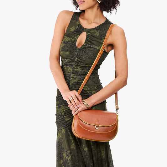 Sienna*Large | Model wearing a leather Crossbody with a flap and magnetic closure