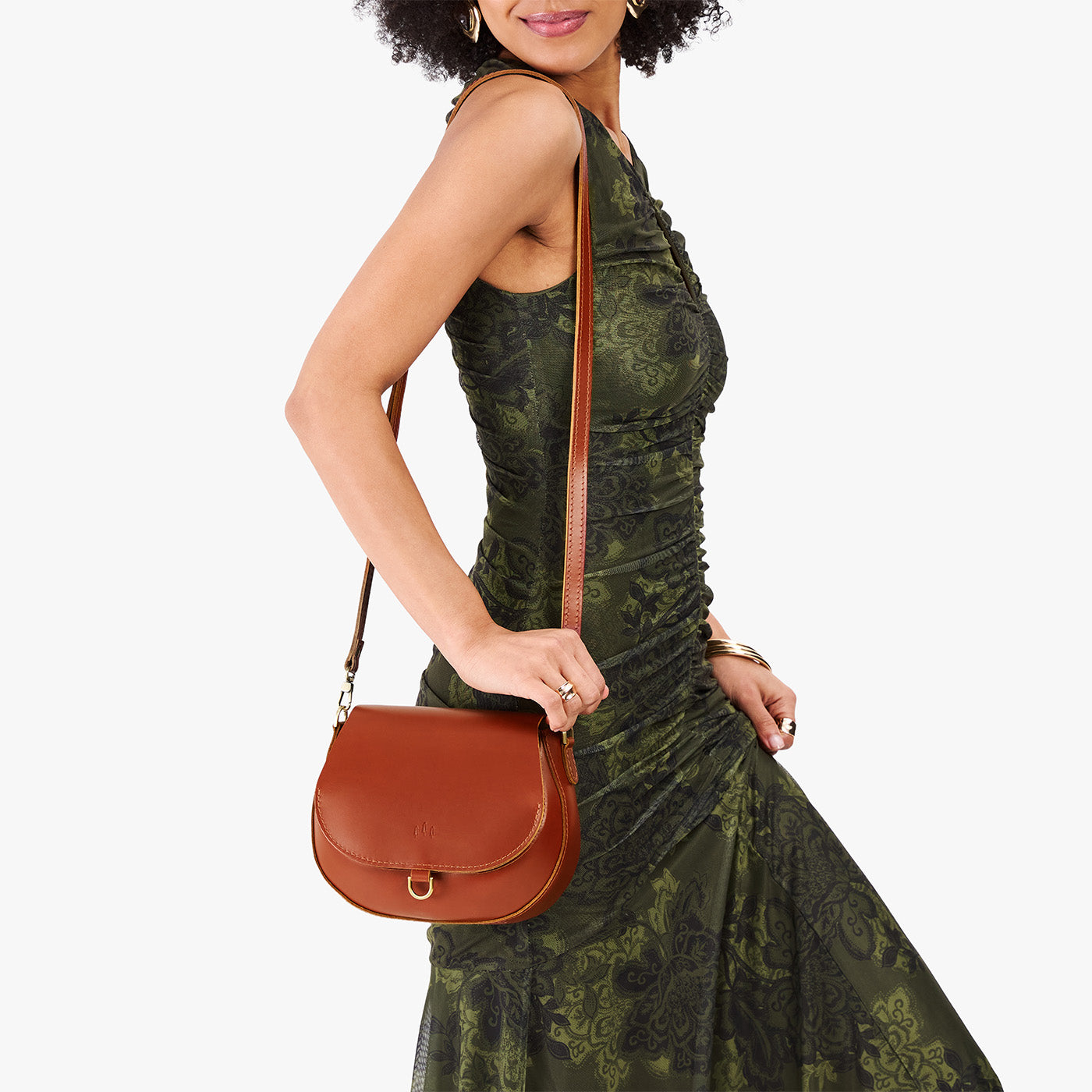 Madrone*Small | Model wearing a petite leather Crossbody with a flap and magnetic closure