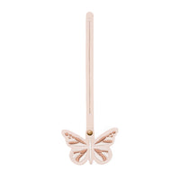 Oatmilk | Embroidered butterfly tassel accessory on a bag