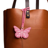Wild Rose | Embroidered butterfly tassel accessory on a bag